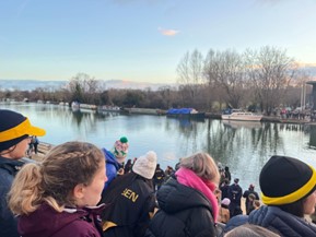Students watch Torpids boat race from the rooftops