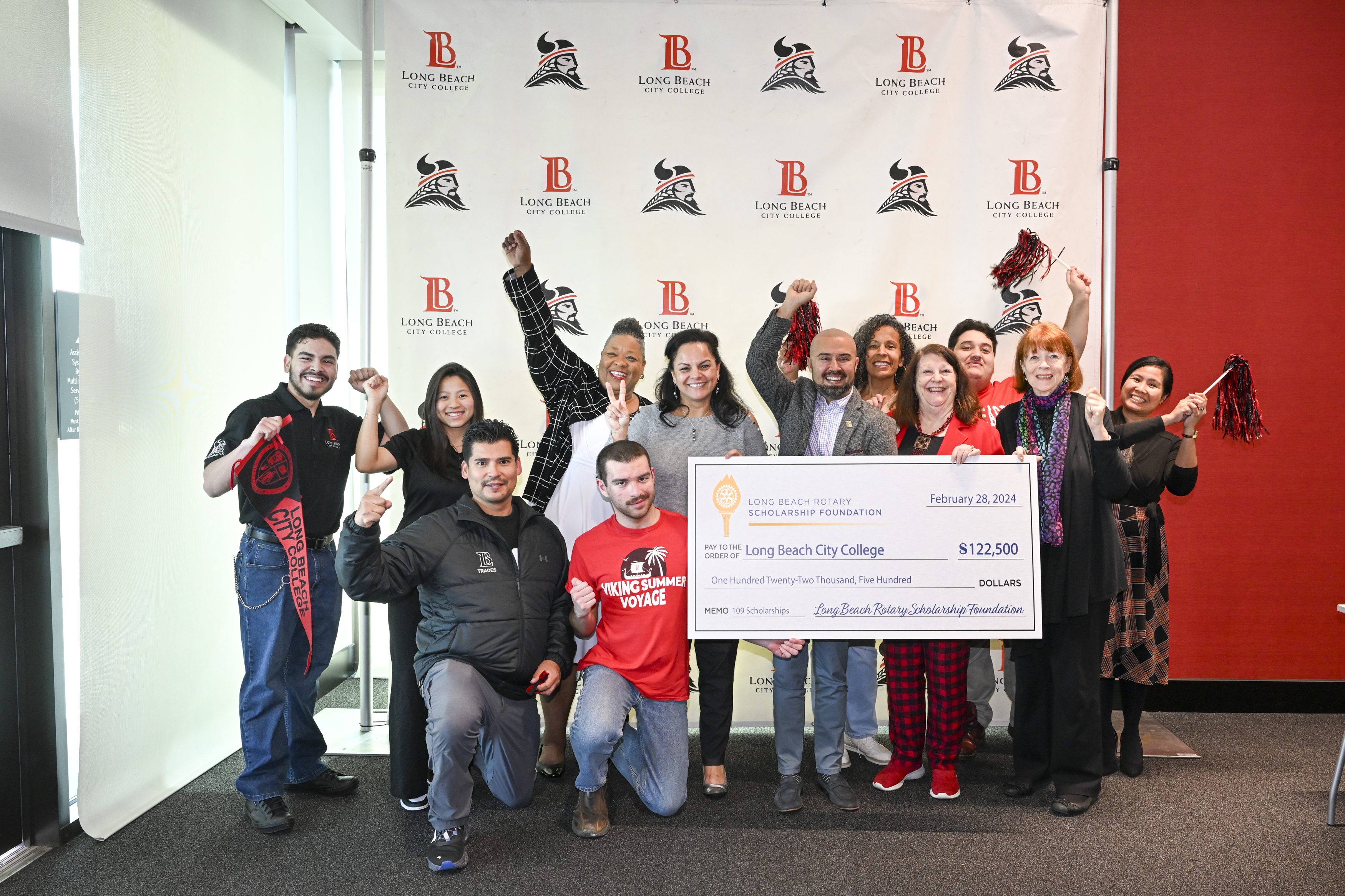 long beach city college is presented with a check by the long beach rotary scholarship foundation
