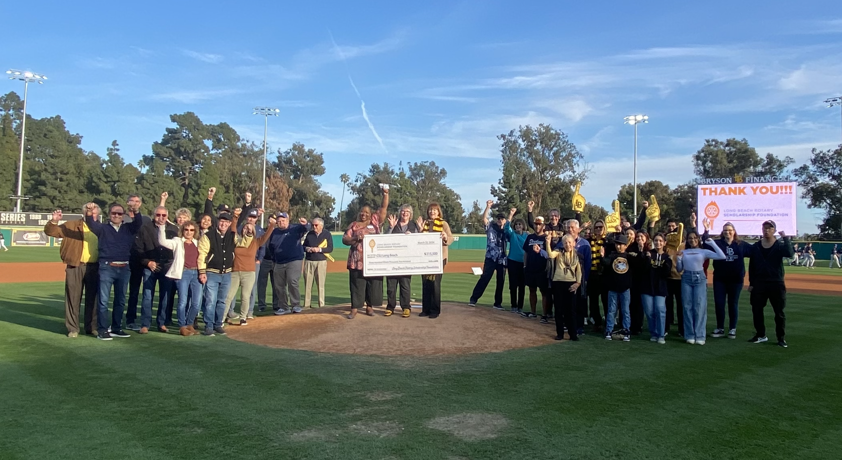 long beach rotary scholarship foundation presents csulb with a check